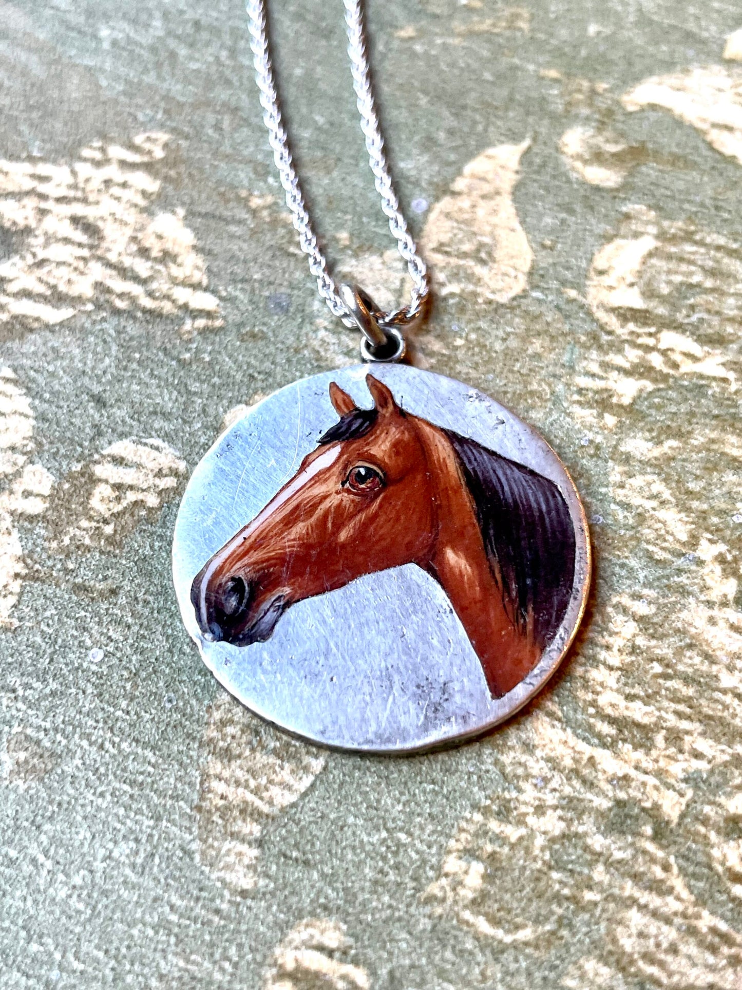 Silver pendant with enamel horse head